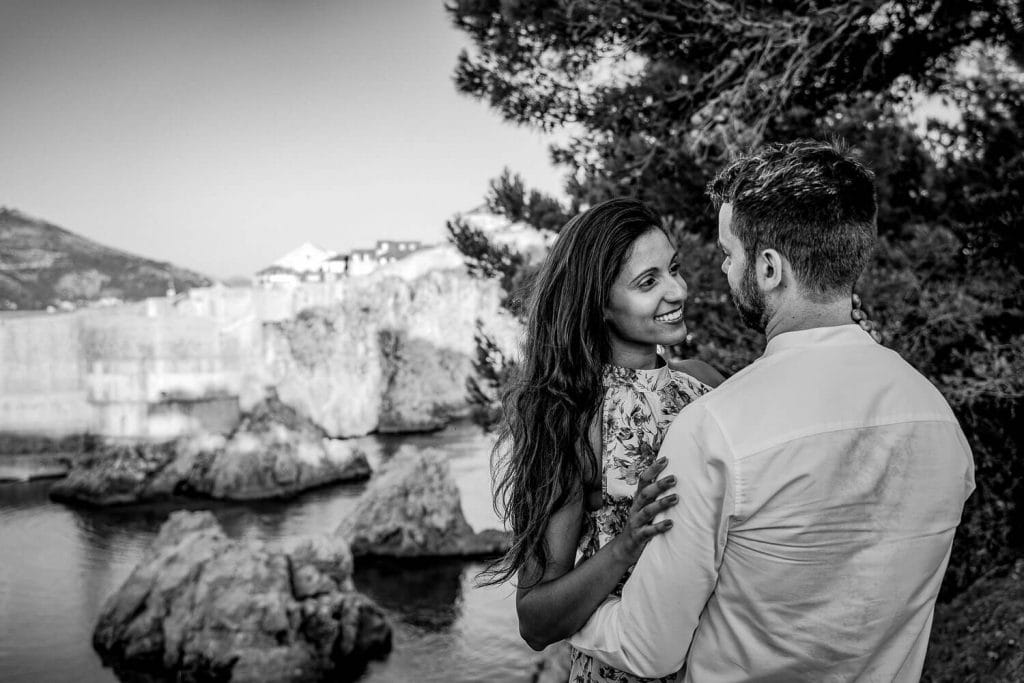 Couple in love under the Lovrijenac Fort in Dubrovnik Old Town with local photographer