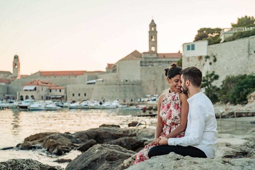 Couple on the rocks near the sea in Dubrovnik Old Town